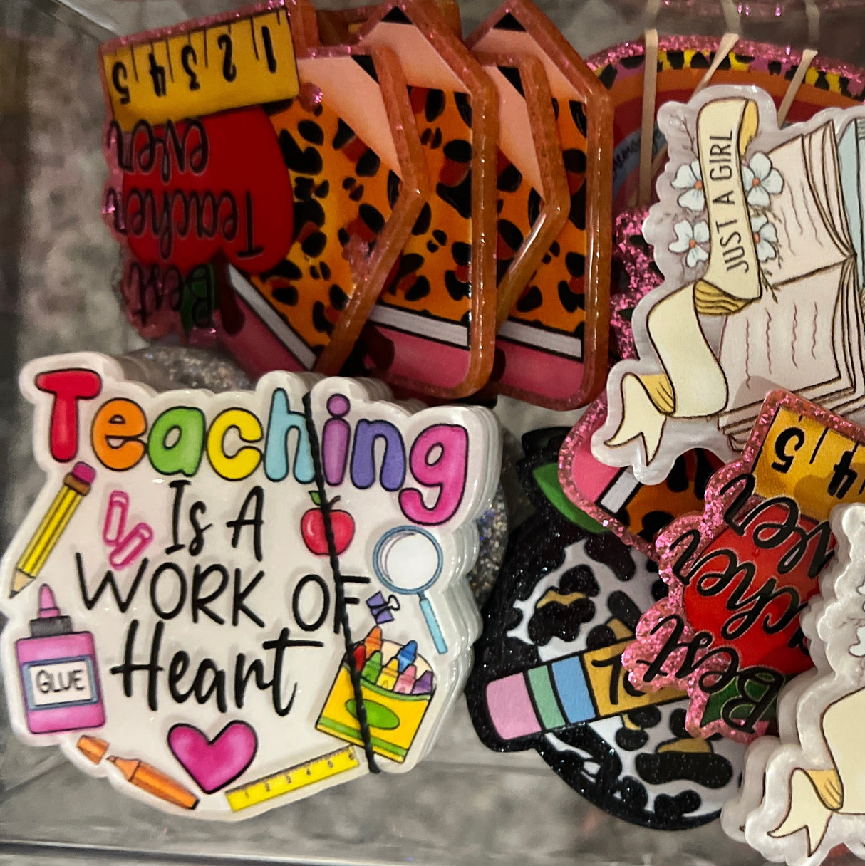 Collection of decorative stickers in a clear container