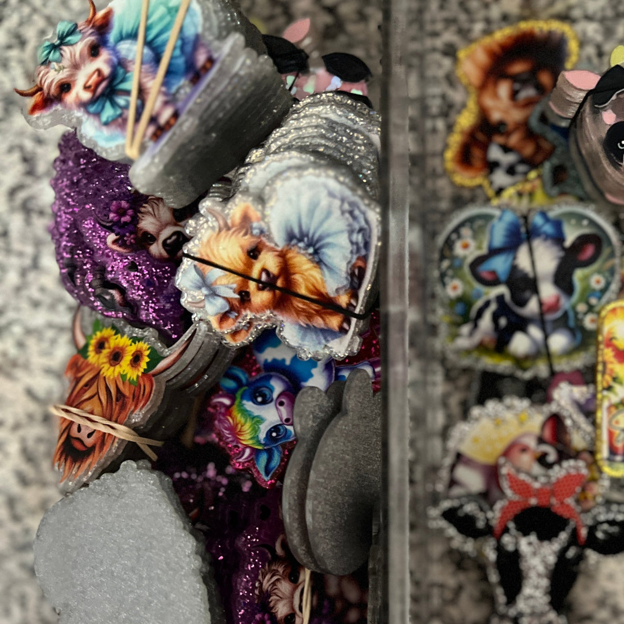 Decorative wall art with colorful animal figures on a textured wall.