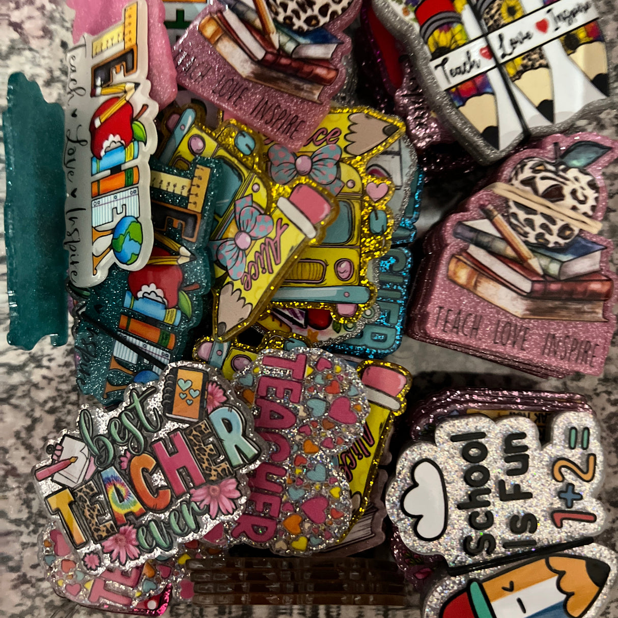 Collection of colorful embroidered patches on a textured surface