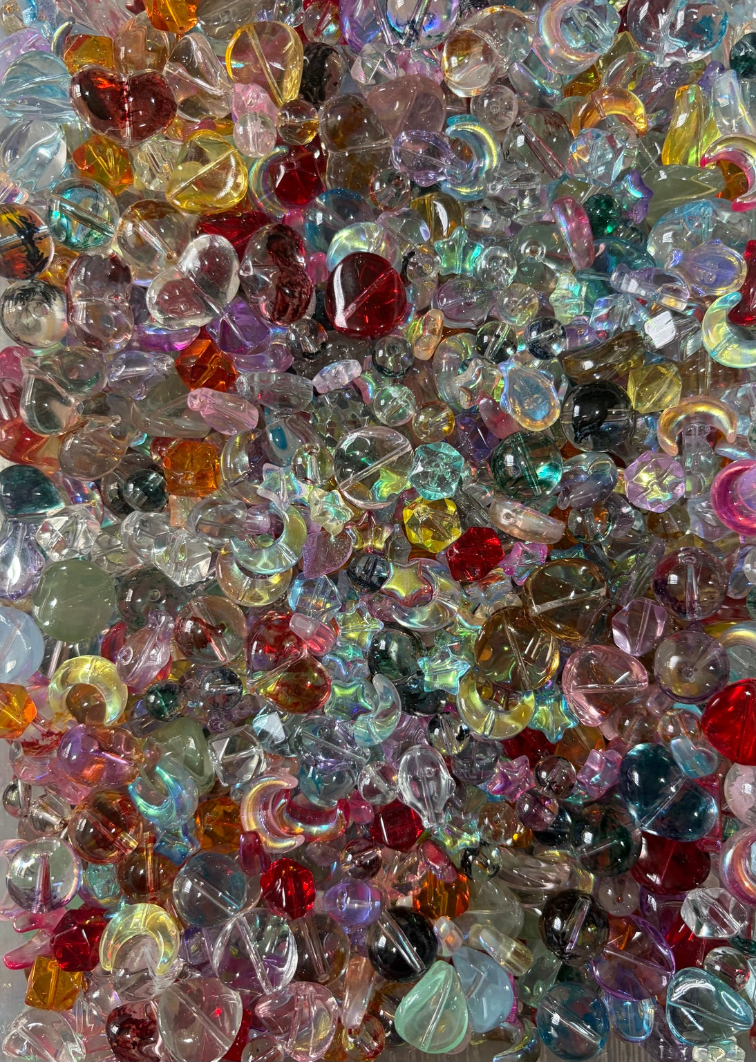 Prism Glow Glass Bead Mix close-up of translucent multicolor glass beads in assorted shapes and sizes