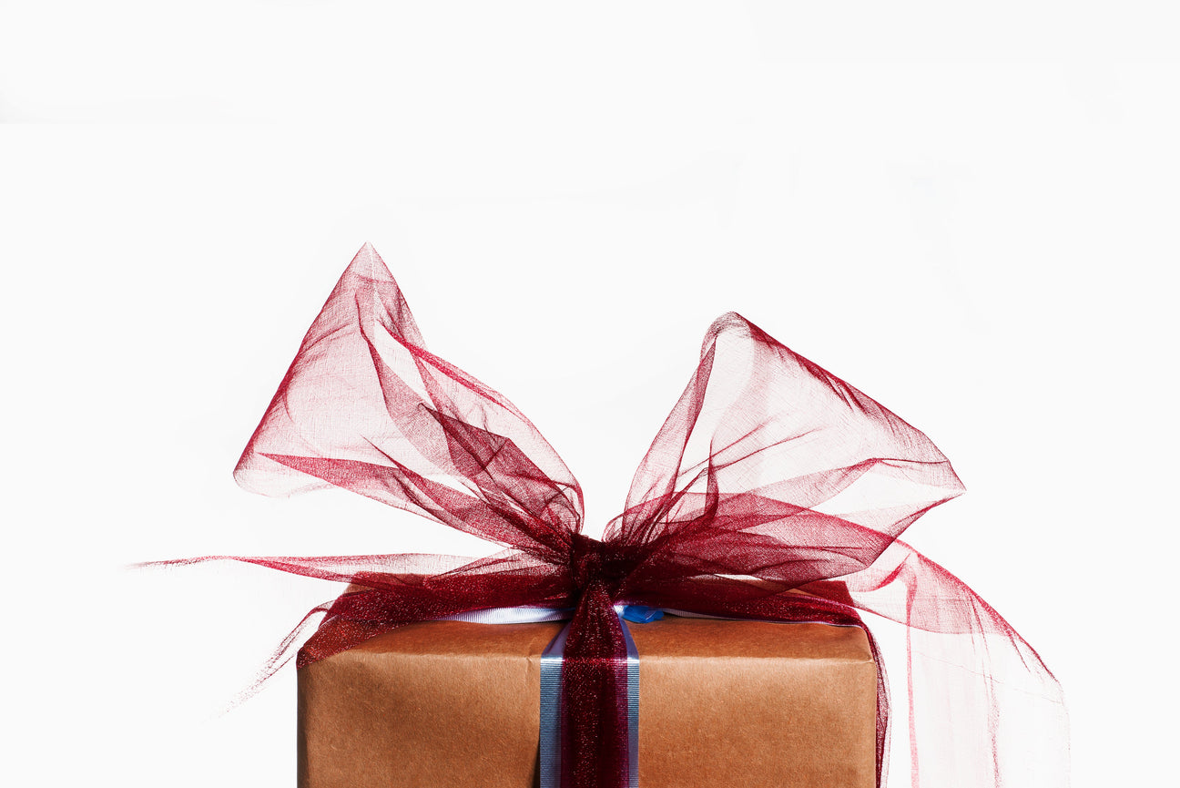 Gift wrapped with a large red bow