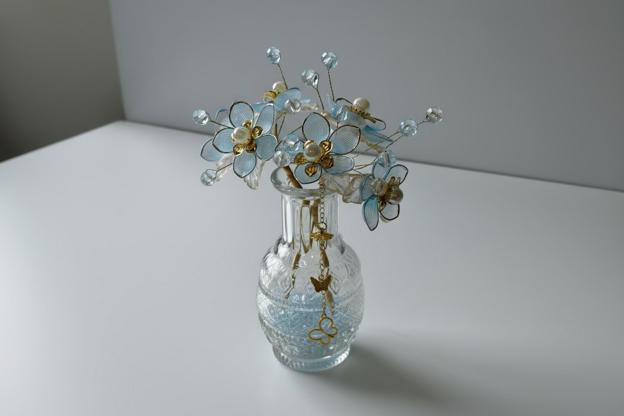 Full view of beaded flower arrangement in textured glass vase
