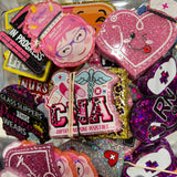 Collection of colorful decorative patches with various designs and text.