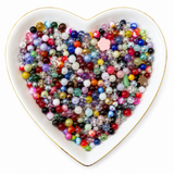 Kafei $1 assorted bead mix in a white heart-shaped dish