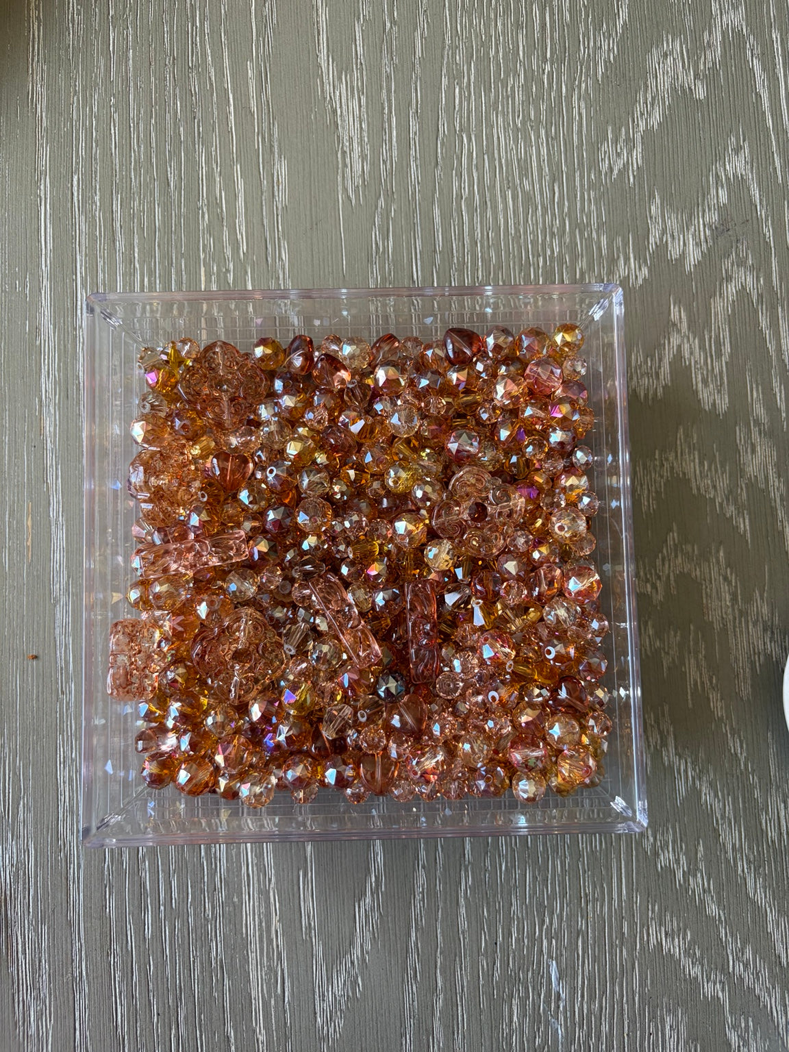 Orange Glow Bling Bling Lux Mix sparkling orange glass bead assortment in clear square container