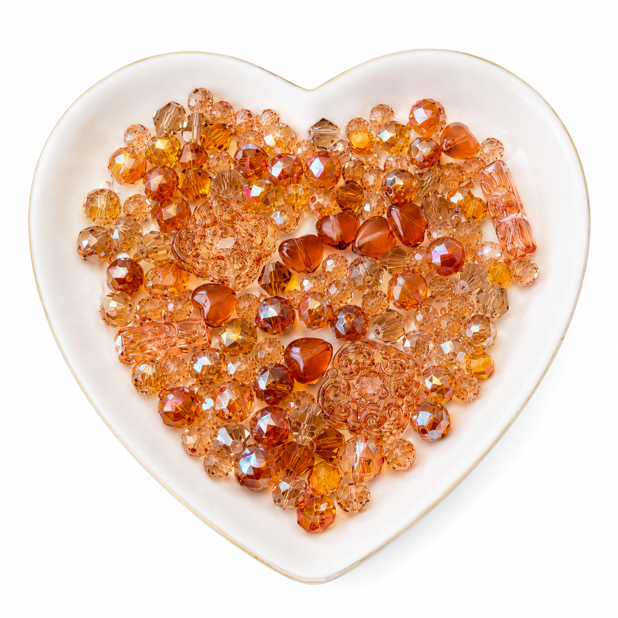 Orange Glow Bling Bling Lux Mix sparkling orange glass bead assortment in heart-shaped dish