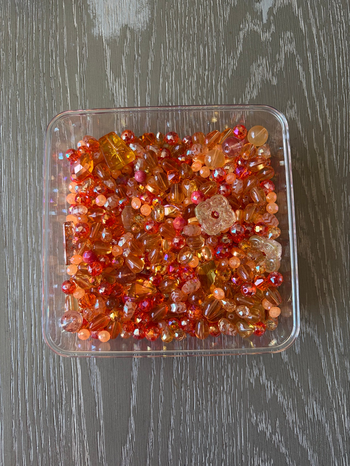 Orange Paradise Bling Bling Lux Mix orange bead assortment in clear container