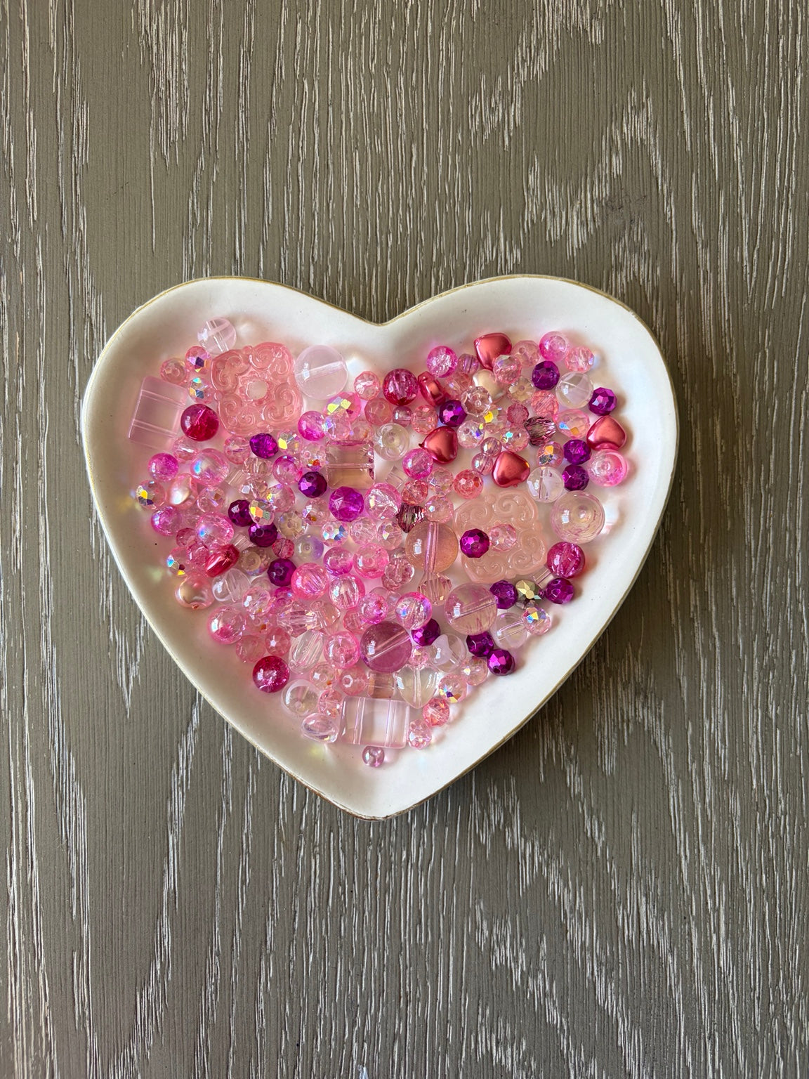 Pink Champagne Bling Bling Lux Mix pink bead assortment in heart-shaped dish