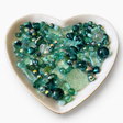 Sea Glass Luxe Mix glass bead assortment in a heart-shaped dish on a white background