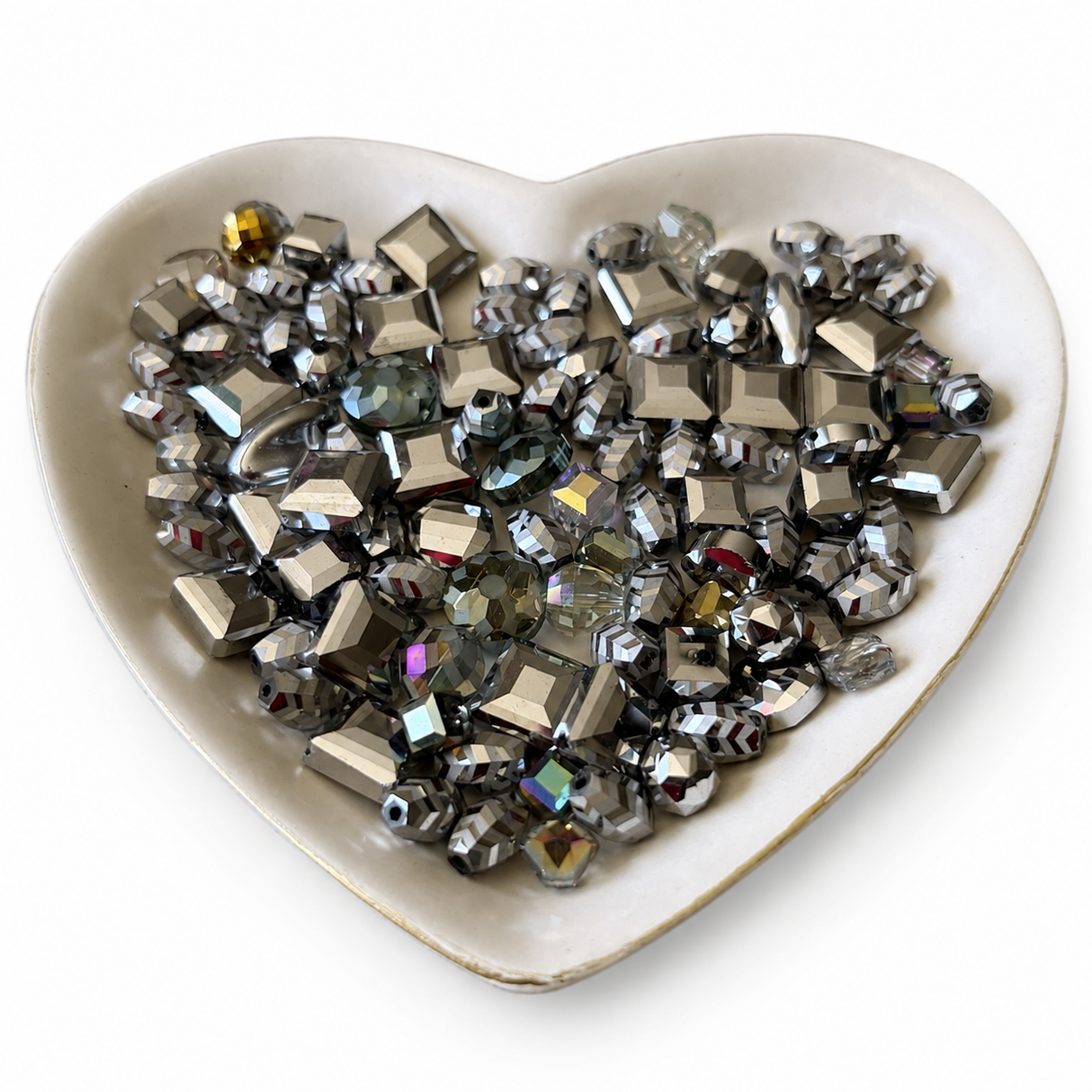 Silver Smoke Luxe Mix glass bead assortment in a heart-shaped dish on a white background