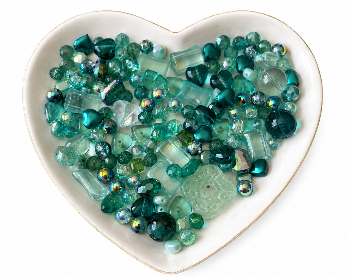 Teal Dreams Bling Bling Lux Mix teal bead assortment in heart-shaped dish on white background
